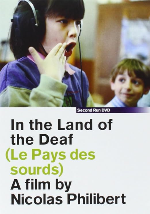 Para todos verem: Texto: "Second Run DVD. In the Land of the Deaf (Le Pays des sourds). A film by Nicolas Philibert". Ilustração: Banner com duas crianças.