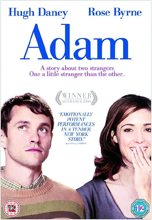 Para todos verem: Texto: "Hugh Dancy. Rose Byrne. Adam. A story about two strangers. One a little stranger than the other... Winner Sundance 2009. Emotionally potent performances in a tender New York story - Variety. Ilustração: Banner em que no lado esquerdo há um homem olhando para cima e no lado direito há uma mulher com a mão na boca sorrindo. 