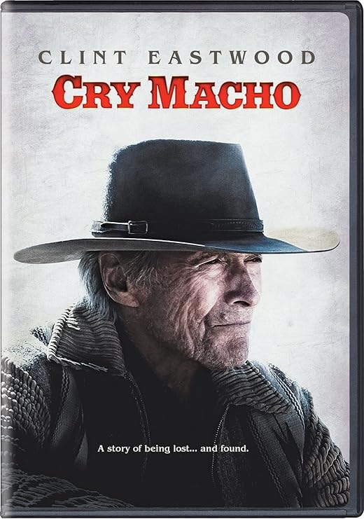 Para todos verem: Banner do filme em que há um senhor de jaqueta e chapéu. Lê-se: "Clint Eastwood. Cry Macho. A story of being lost... and found."