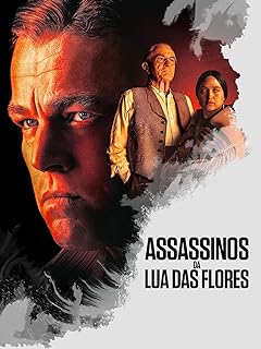 Para todos verem: Banner do filme em que há o rosto de um homem, um senhor e uma mulher indígena. Lê-se: "Assassinos Da Lua Das Flores".