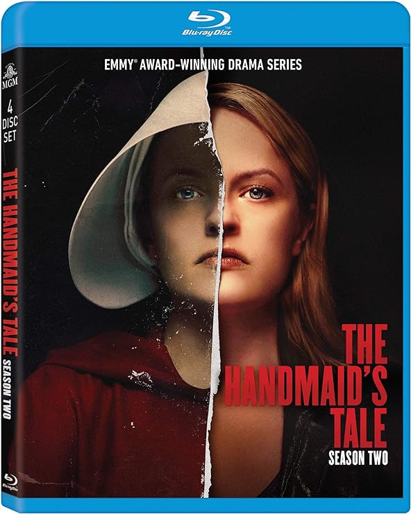 Para todos verem: Banner da série com uma mulher vestida no lado esquerdo de aia e no lado direito com uma jaqueta preta. No banner se lê: "Blu-ray Disc. Emmy Award -Winning Drama Series. The handmaid's tale. Season 2."