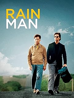 Para todos verem: Texto: "Rain man". Ilustração: Banner em que há dois homens caminhando em uma estrada. Um dos homens está usando óculos escuros e está segurando uma mochila.