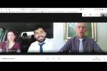 Print de uma audiência por vídeo em que advogado e sua cliente participam de dentro de um carro