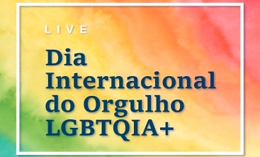 Imagem com fundo colorido, com os dizeres " Dia Internacional do Orgulho LGBTQIA+