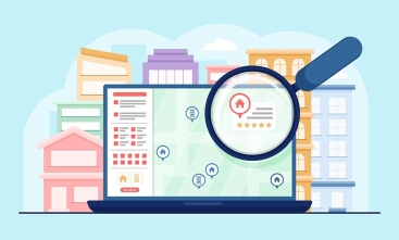 Imagem ilustrativa de um computador e uma lupa na frente da tela