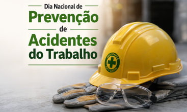 Dia Nacional de Prevenção de Acidentes de Trabalho. Imagem de um capacete amarelo sobre uma luva e um óculos de segurança do lado