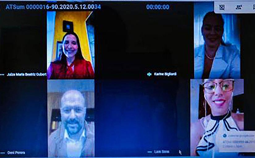 Print de tela de uma videoconferência mostrando quatro pessoas