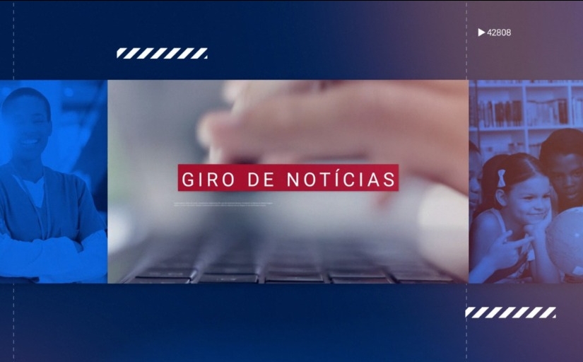 Banner com fundo azul noi qual há fotografias diversas. Na imagem central está uma mão sobre um teclado. Em um fundo vermelho está escrito "Giro de Notícias".