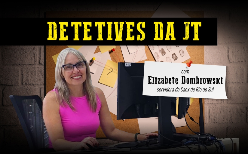 Detetives da JT: Elizabete Dombrowski, servidora da Caex de Rio do Sul. Uma mulher de blusa cor de rosa, loira, sorrindo em frente a um monitor. Ao fundo, um quadro com diversos papeis pendurados, como se estivesse em uma delegacia.