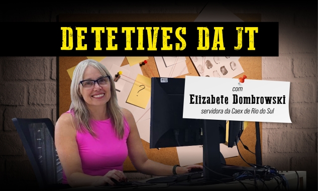 Detetives da JT: Elizabete Dombrowski, servidora da Caex de Rio do Sul. Uma mulher de blusa cor de rosa, loira, sorrindo em frente a um monitor. Ao fundo, um quadro com diversos papeis pendurados, como se estivesse em uma delegacia.